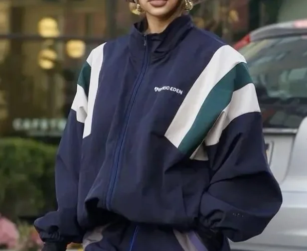 Original reference photo of the navy jacket with white and green panels.