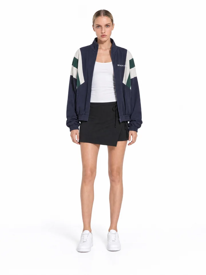 Generated front view of a model wearing the jacket with a black wrap skirt.